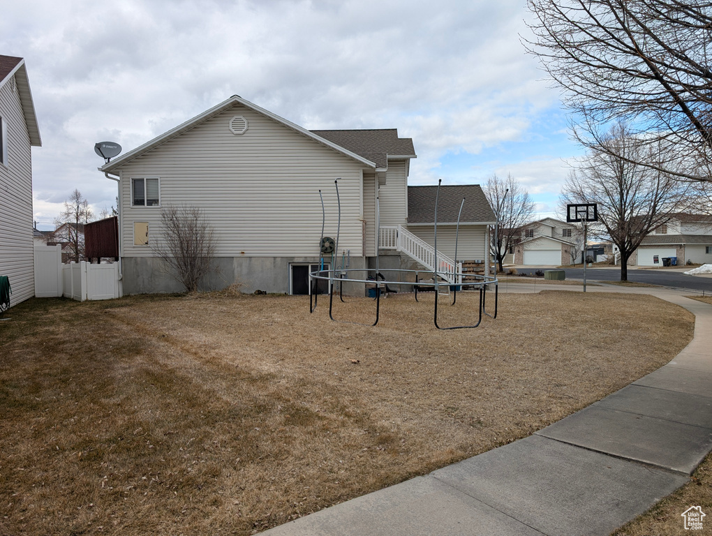 View of home\'s exterior with fence