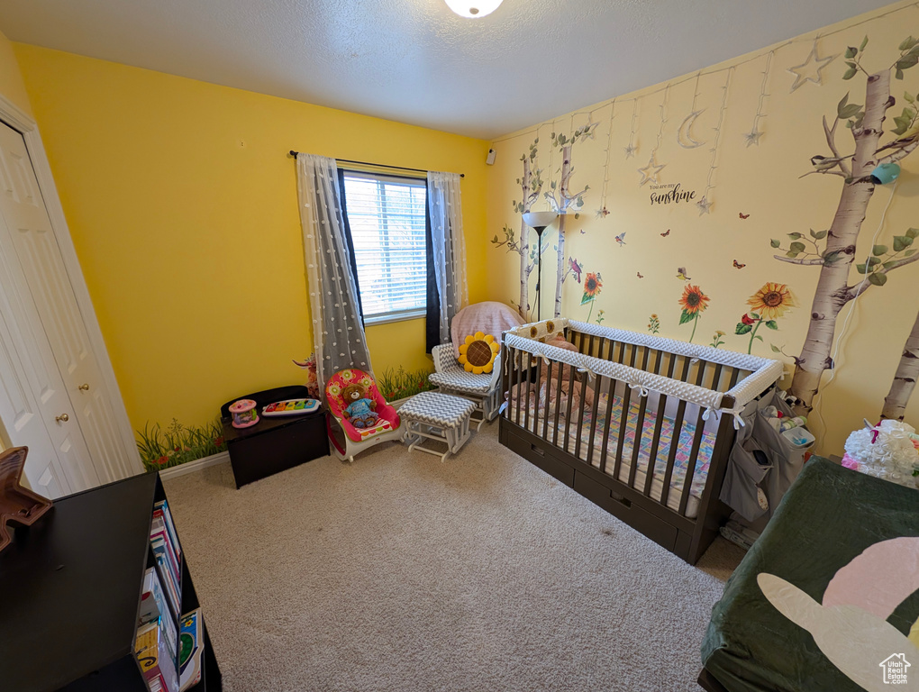 Carpeted bedroom with baseboards