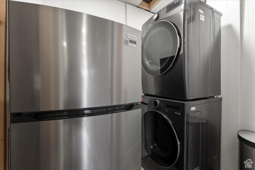 Clothes washing area with stacked washer and clothes dryer and laundry area