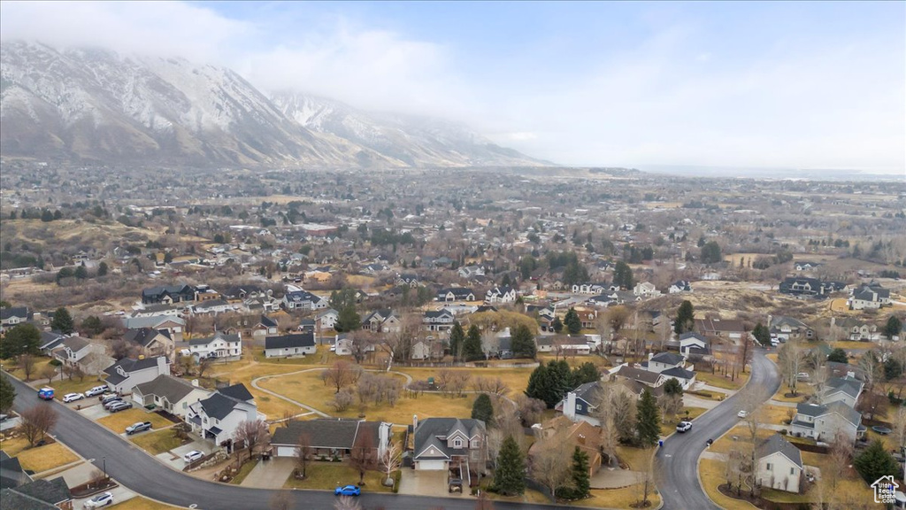 Birds eye view of property with a residential view and a mountain view