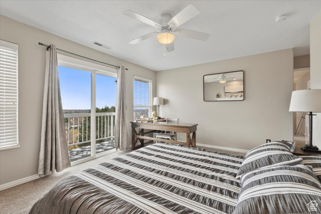 Bedroom featuring access to outside, carpet, ceiling fan, and baseboards