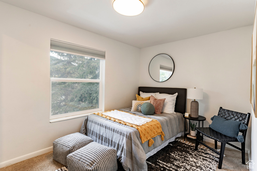 Carpeted bedroom with baseboards