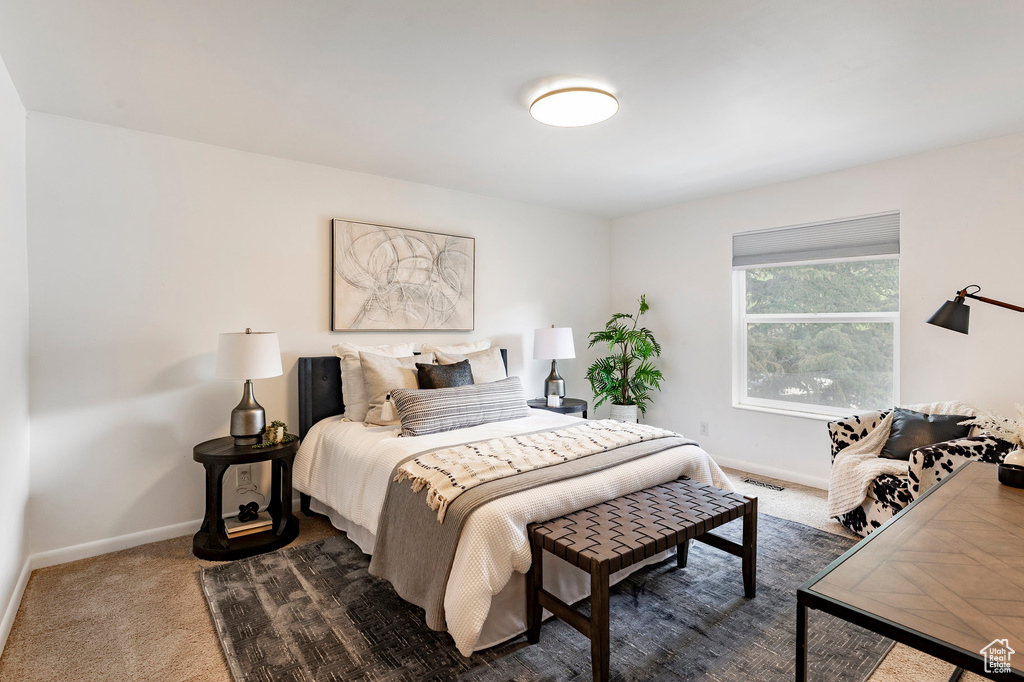 Bedroom with baseboards and carpet floors