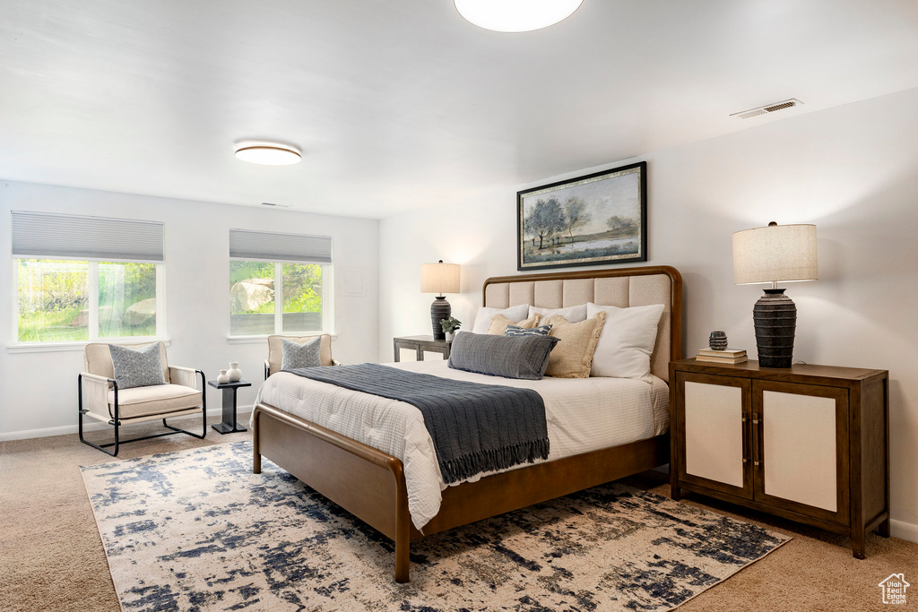 Carpeted bedroom with baseboards
