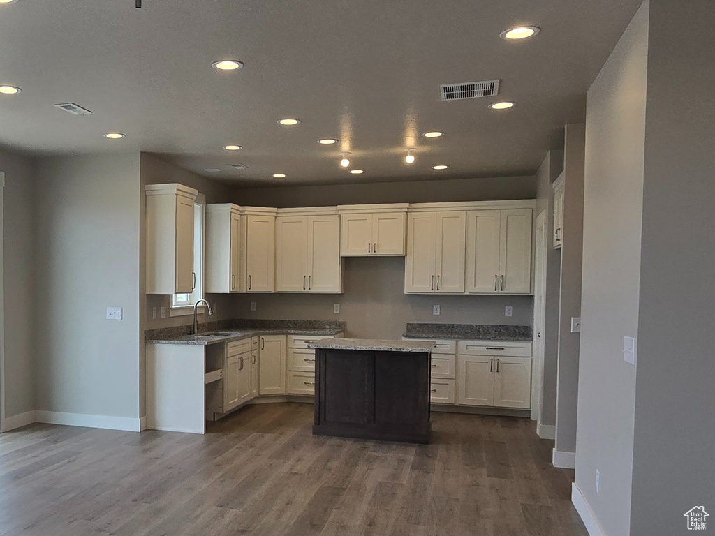 Kitchen with a ceiling fan, baseboards, a healthy amount of sunlight, and a mountain view