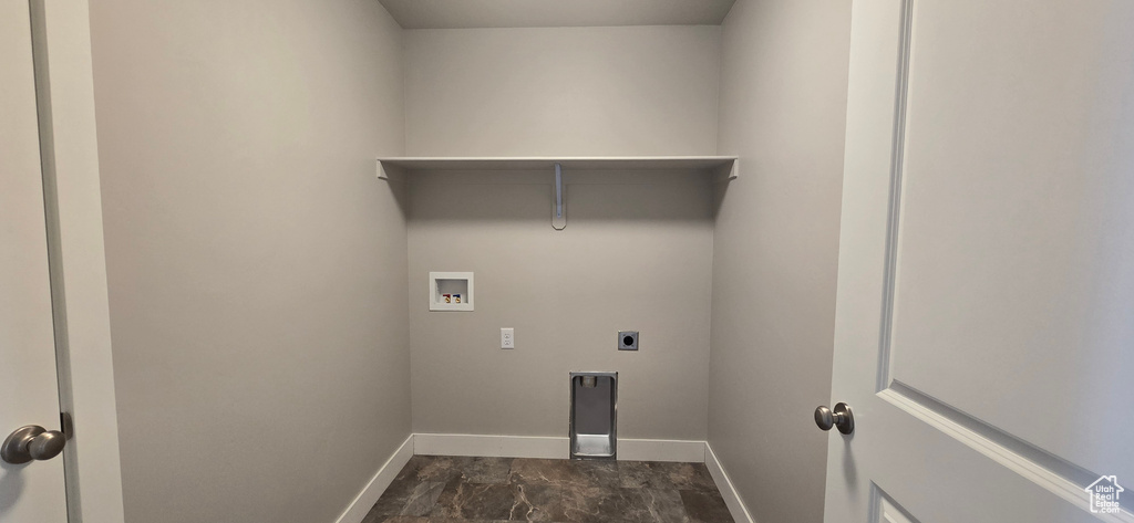 Laundry area featuring laundry area, hookup for an electric dryer, baseboards, and washer hookup