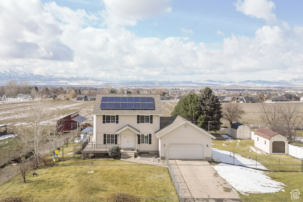 Birds eye view of property with a mountain view