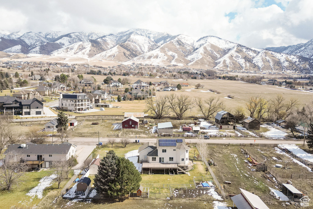 Birds eye view of property with a residential view and a mountain view