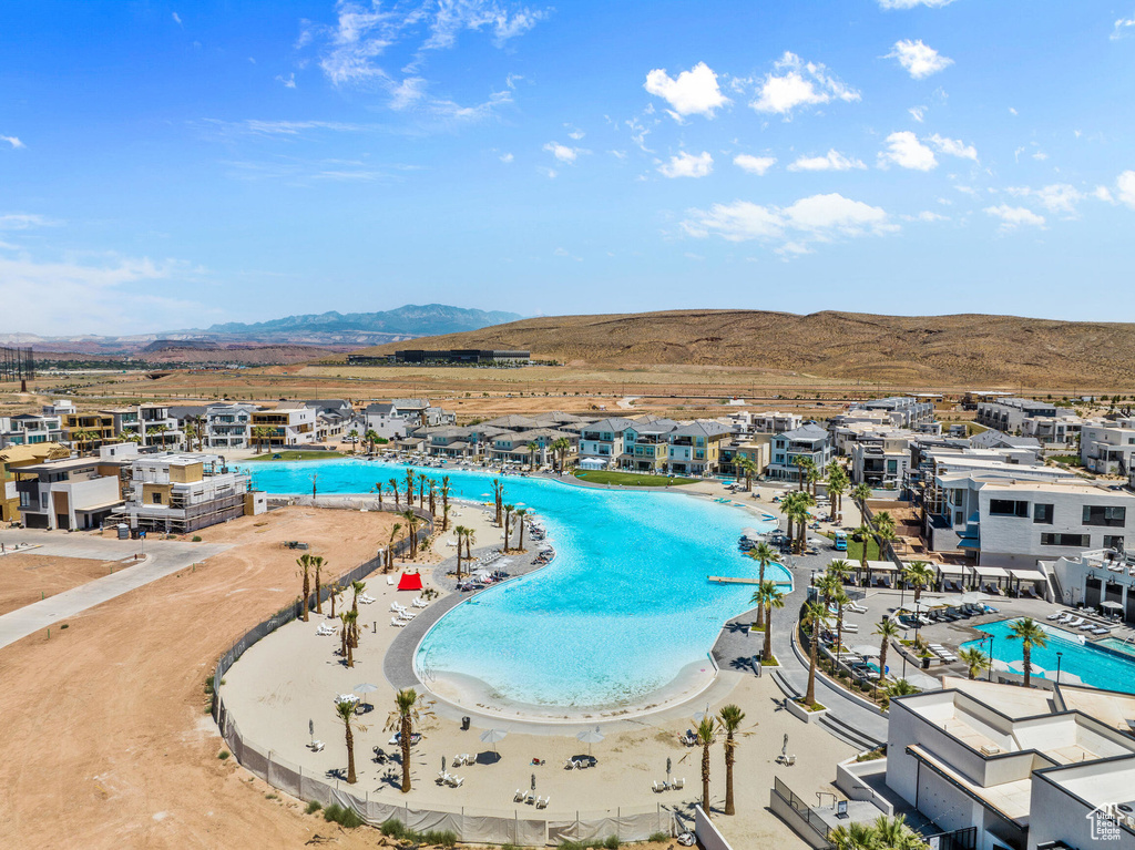 View of swimming pool with a mountain view