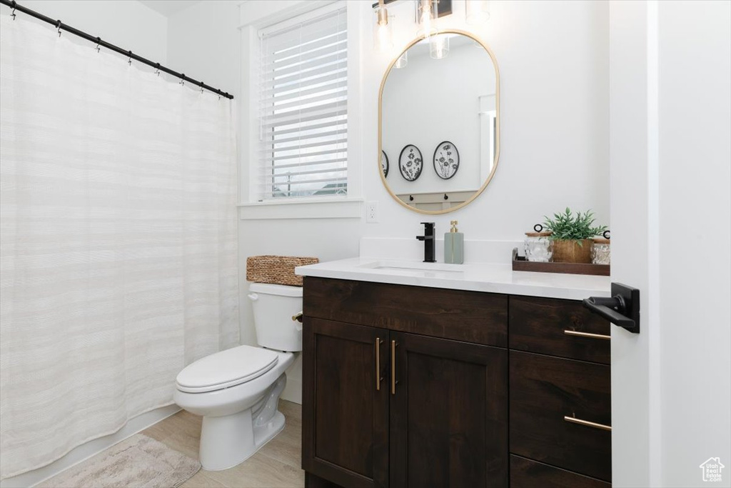 Full bathroom featuring vanity and toilet