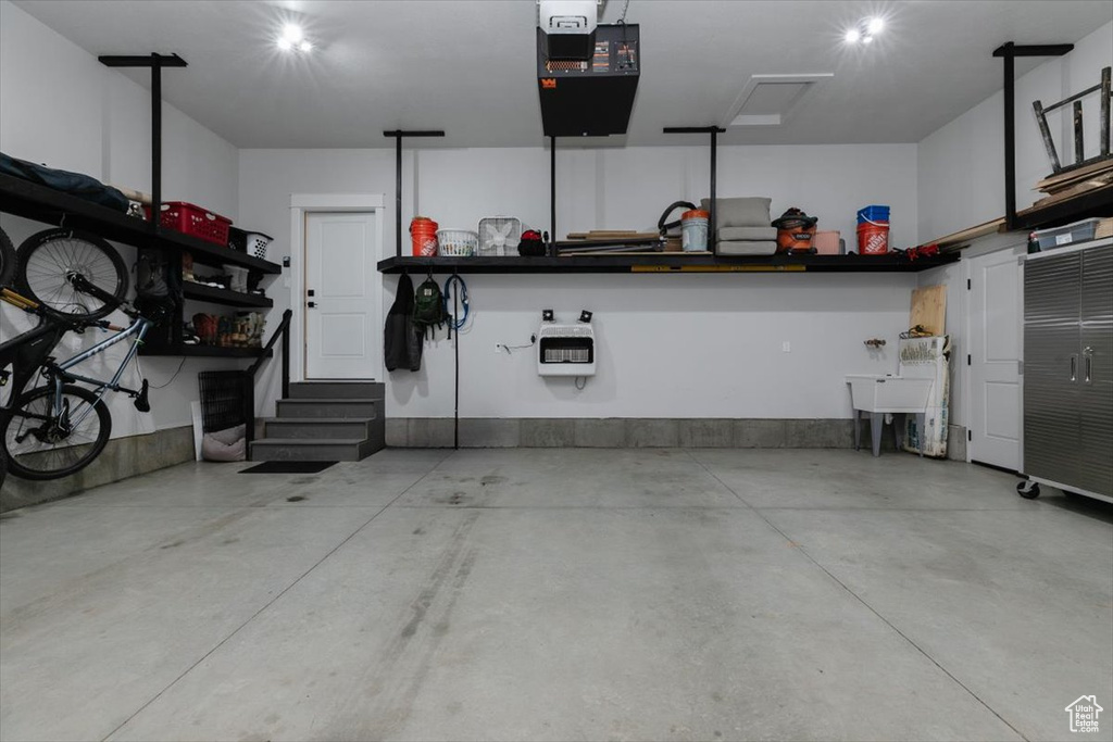 Garage featuring a garage door opener