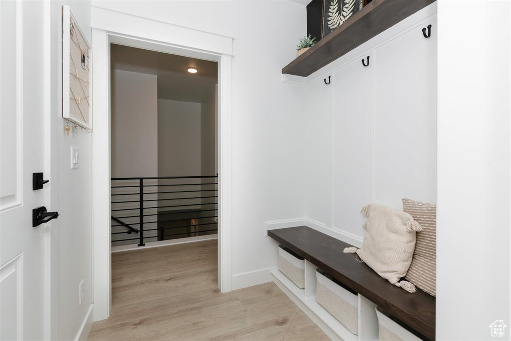 Mudroom with light wood-style flooring