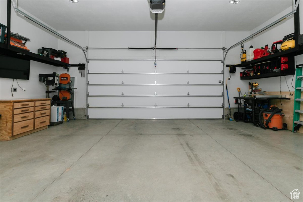 Garage featuring a garage door opener