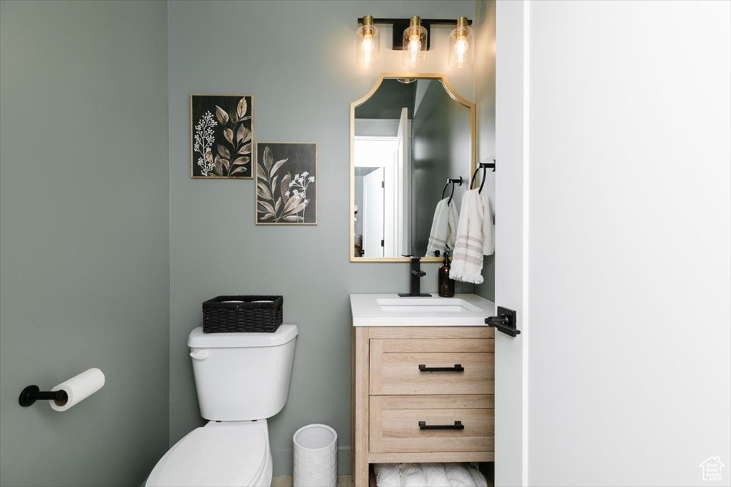 Bathroom featuring vanity and toilet