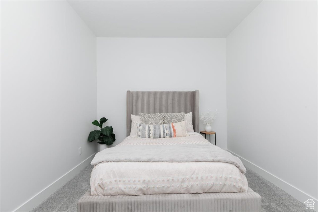 Carpeted bedroom with baseboards