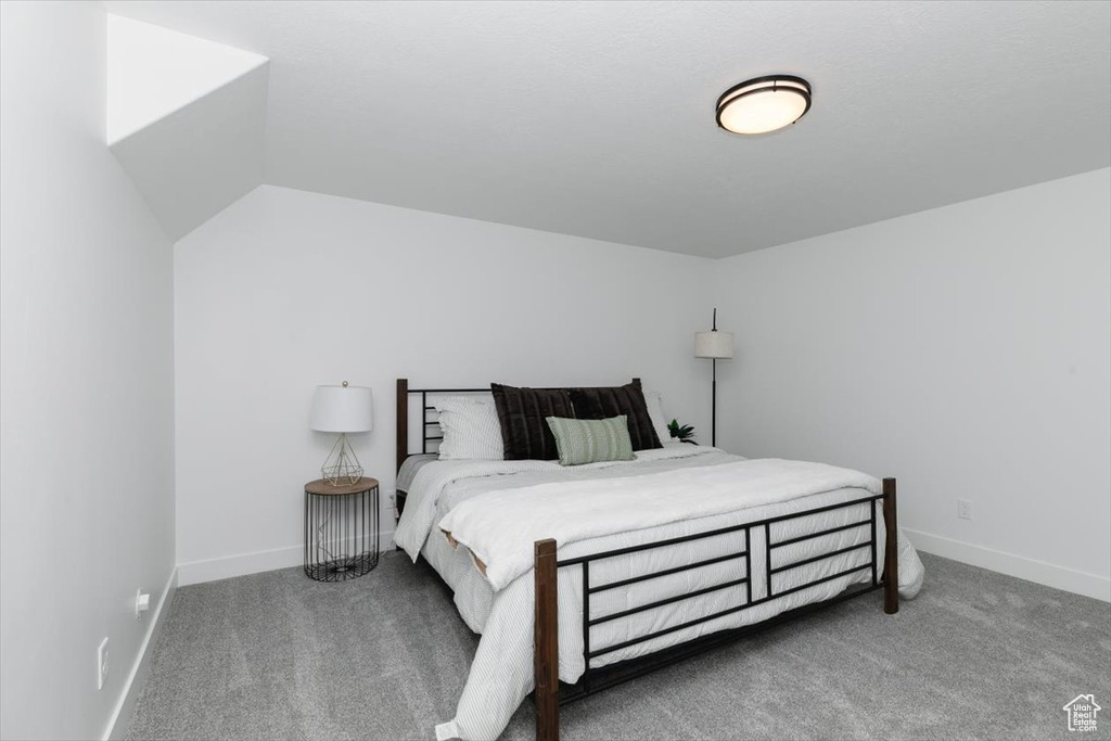 Bedroom featuring baseboards and carpet flooring