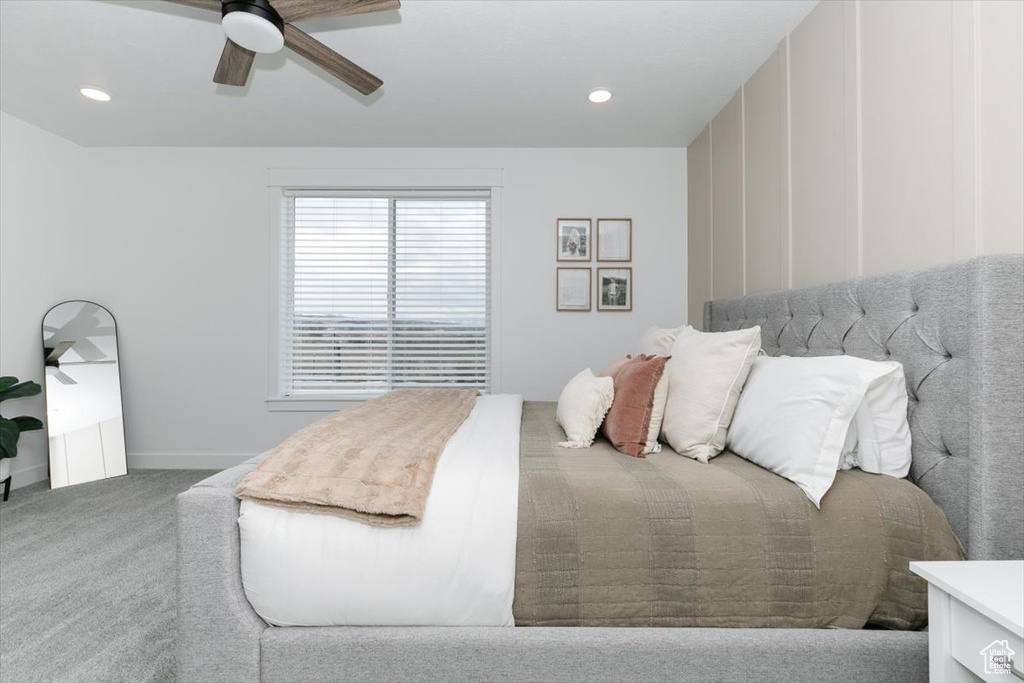 Carpeted bedroom with baseboards, a ceiling fan, and recessed lighting