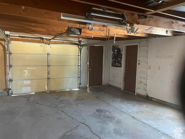 Garage featuring a garage door opener
