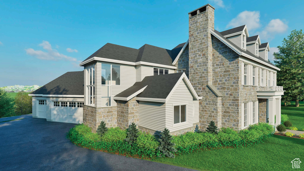 View of side of property with stone siding, a chimney, asphalt driveway, and an attached garage