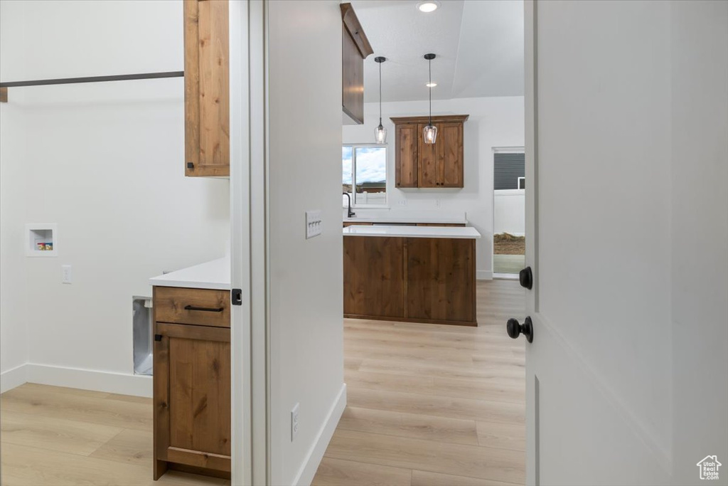 Bathroom featuring recessed lighting, wood finished floors, vanity, and baseboards