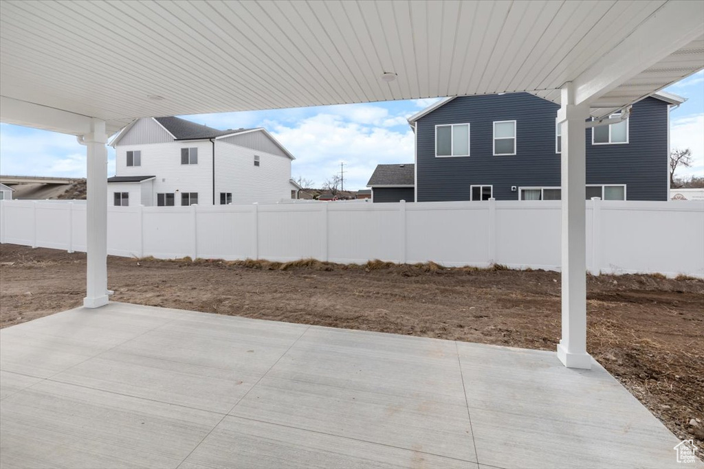 View of patio with a fenced backyard