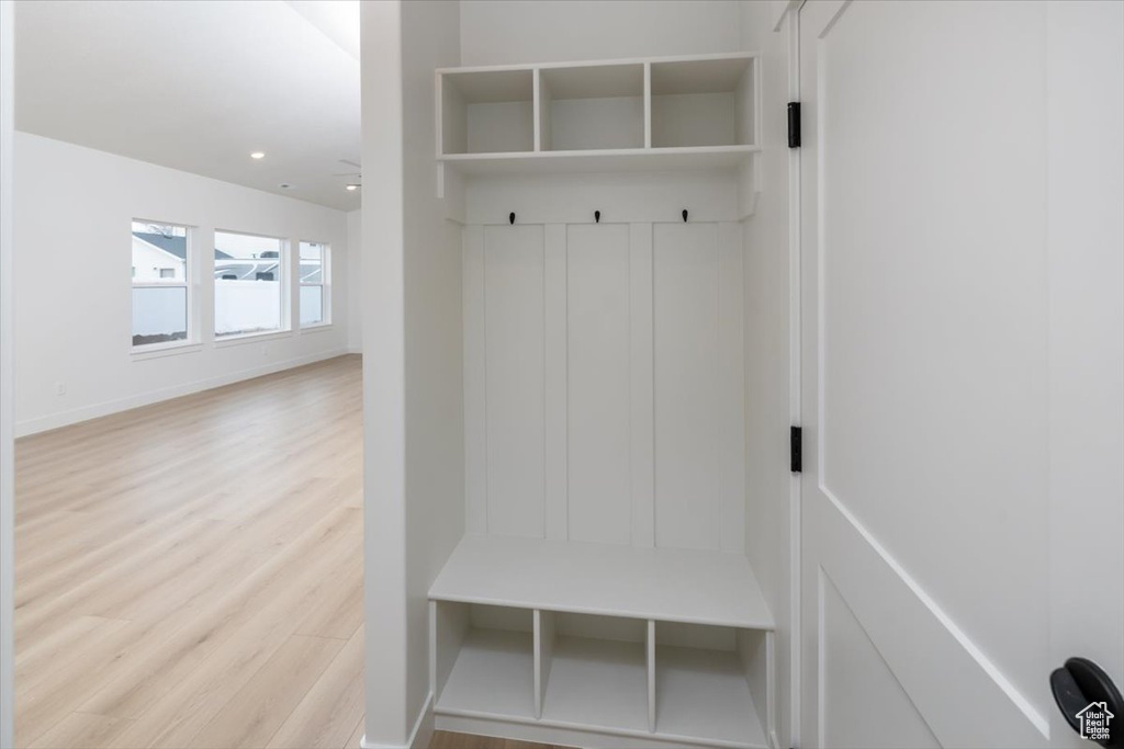 Mudroom featuring recessed lighting, baseboards, and wood finished floors