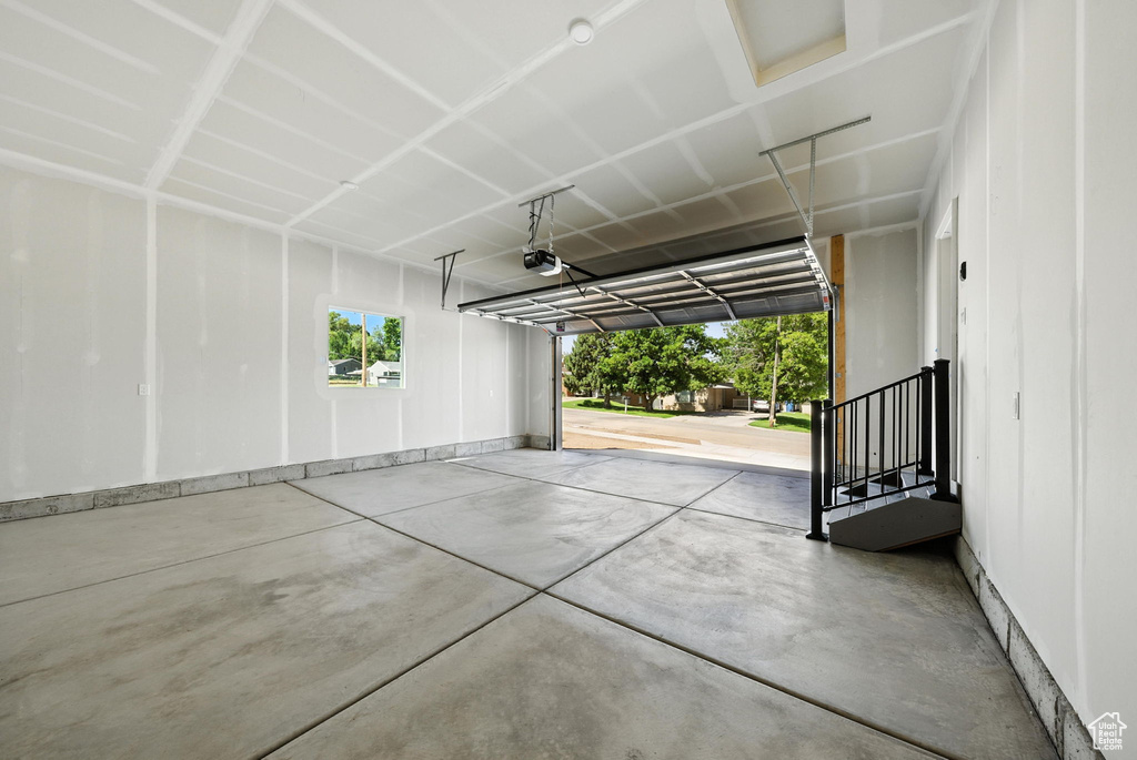 Garage featuring a garage door opener