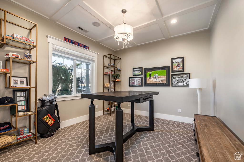 Office space with coffered ceiling, dark colored carpet, a chandelier, and baseboards