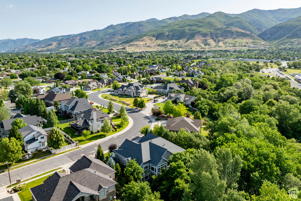 Aerial view of residential area with a mountainous background