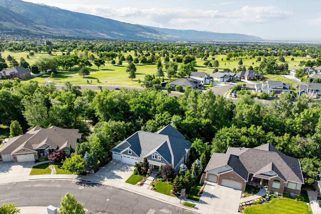 Aerial view of residential area featuring a mountainous background