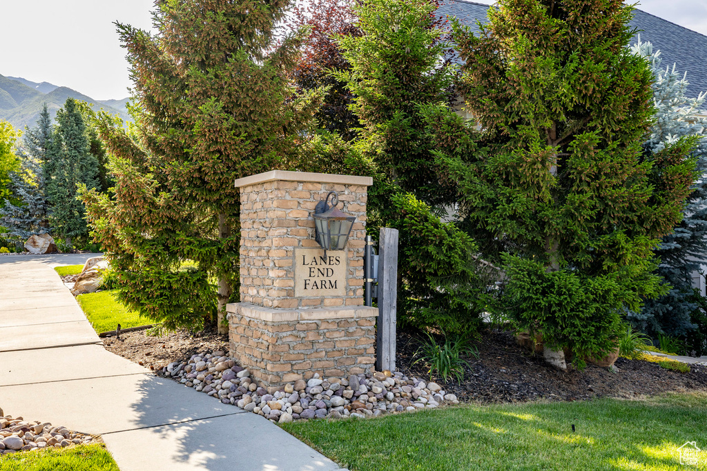 Community sign with a mountain view