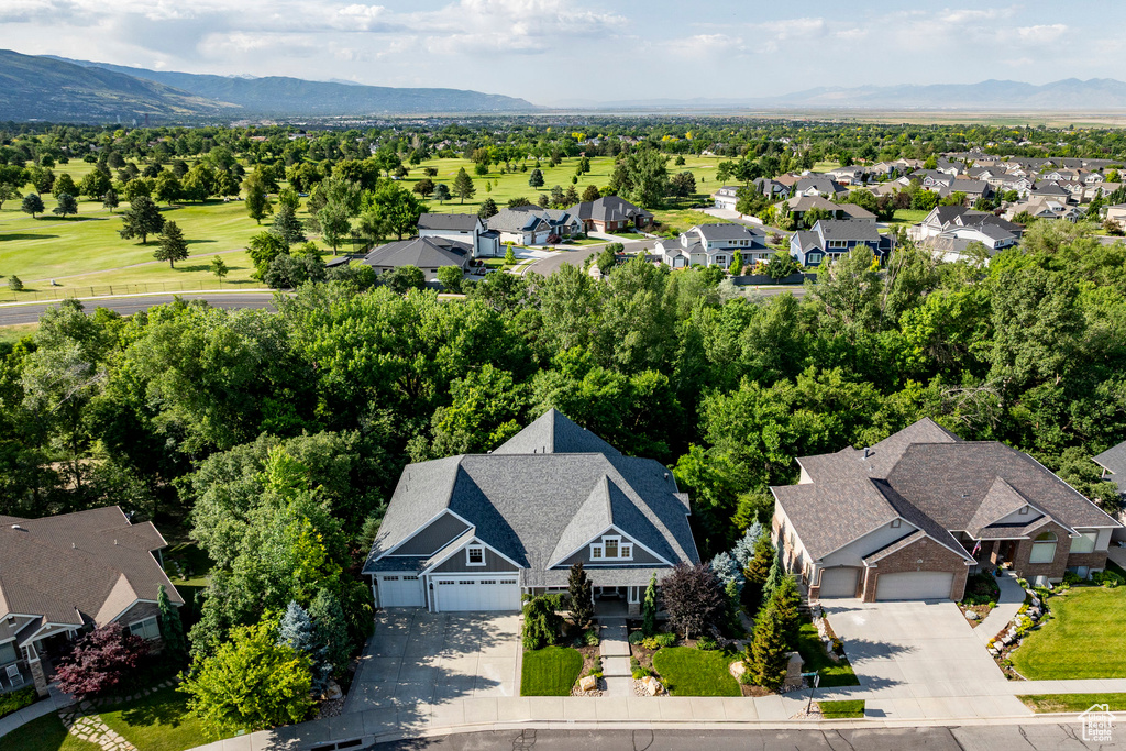 Aerial view of residential area featuring a mountain backdrop