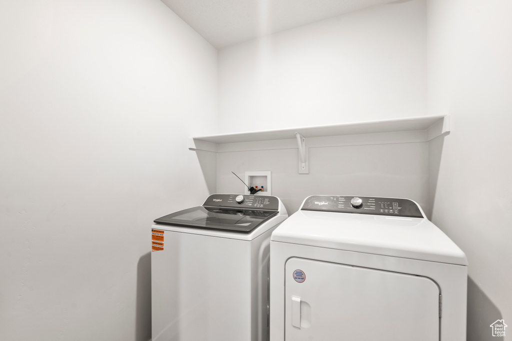 Laundry area featuring laundry area and washer and clothes dryer