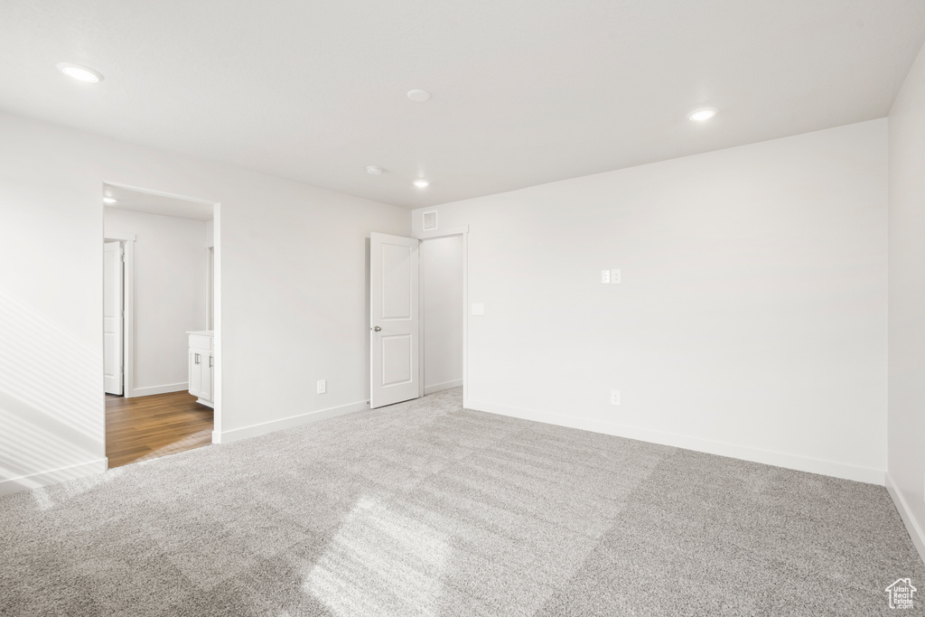 Interior space featuring baseboards and recessed lighting