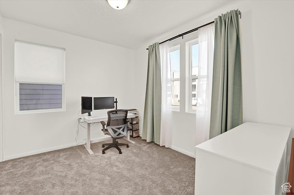 Office area featuring carpet and baseboards