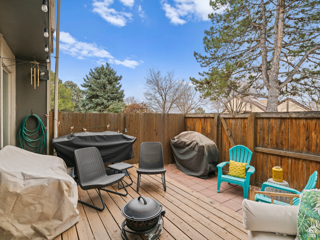 Deck featuring fence and grilling area