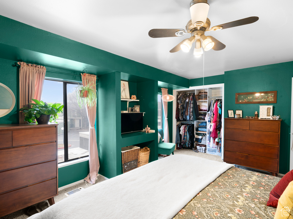 Bedroom featuring a ceiling fan, carpet, a closet, and visible vents