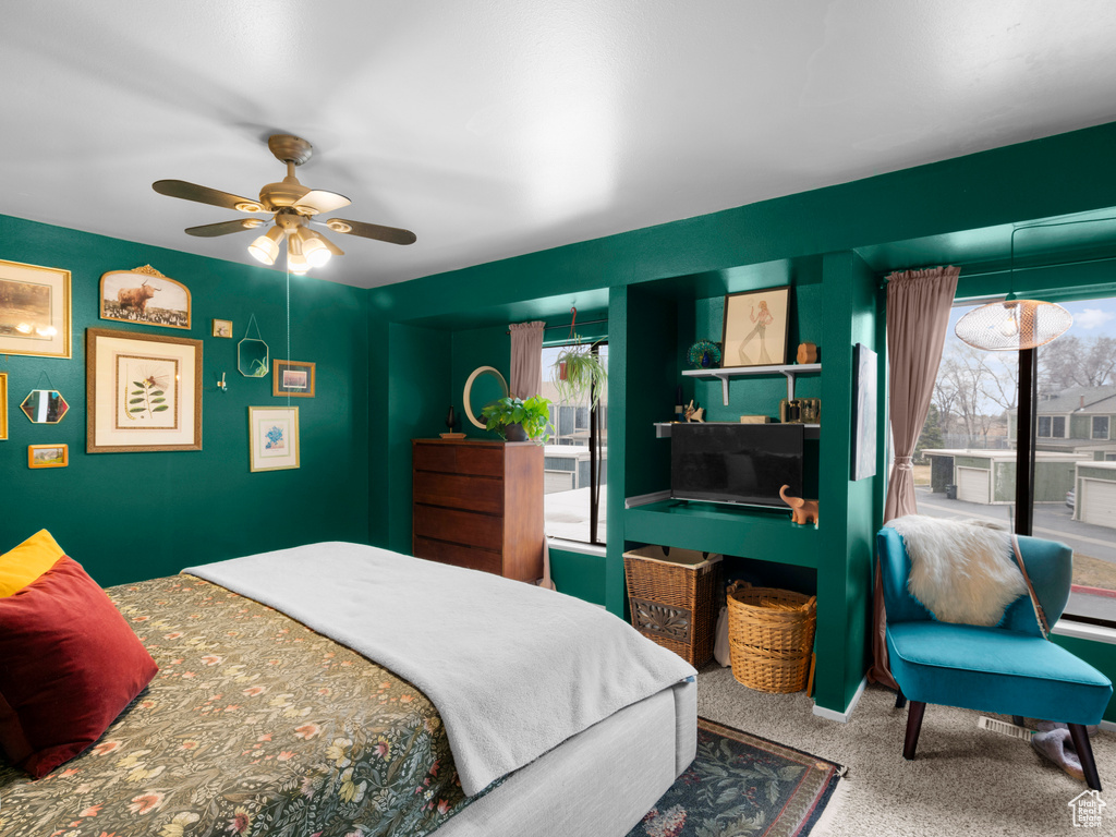 Bedroom featuring carpet and a ceiling fan