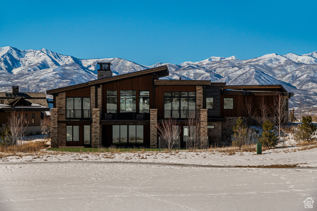 Exterior space featuring a chimney and a mountain view