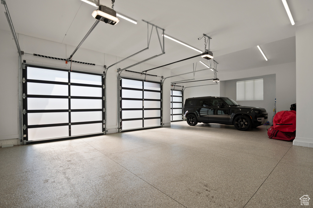 Garage featuring a garage door opener