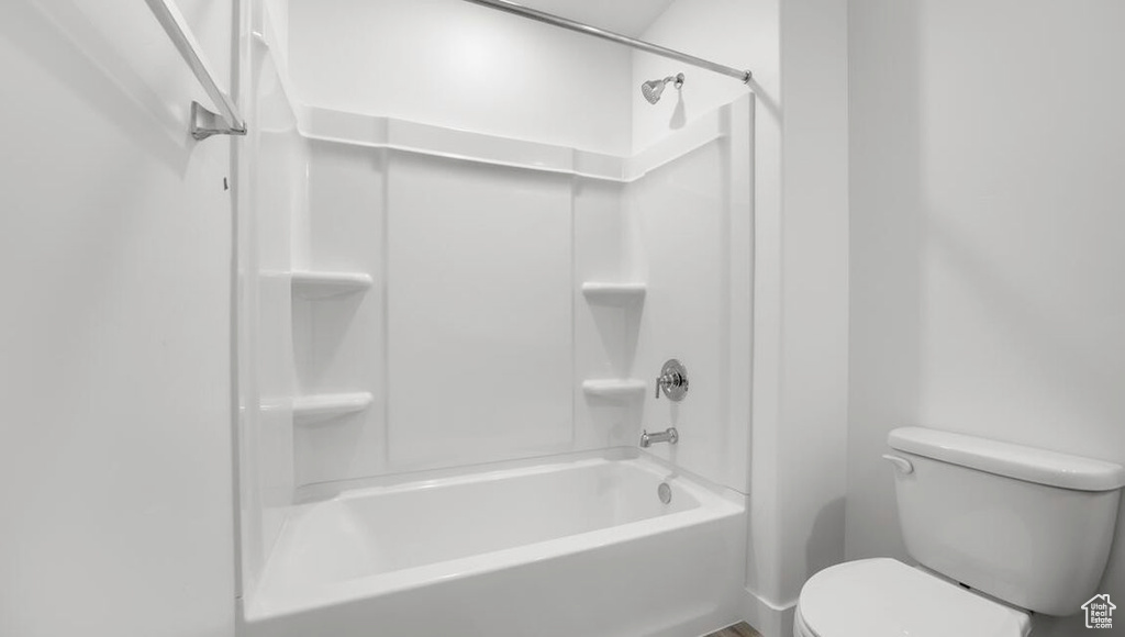 Bathroom with toilet and bathtub / shower combination