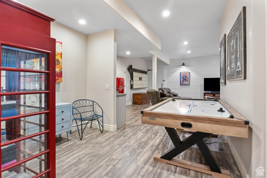 Playroom with baseboards, wood finished floors, and recessed lighting