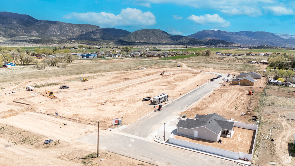Aerial view of sparsely populated area featuring a mountain backdrop