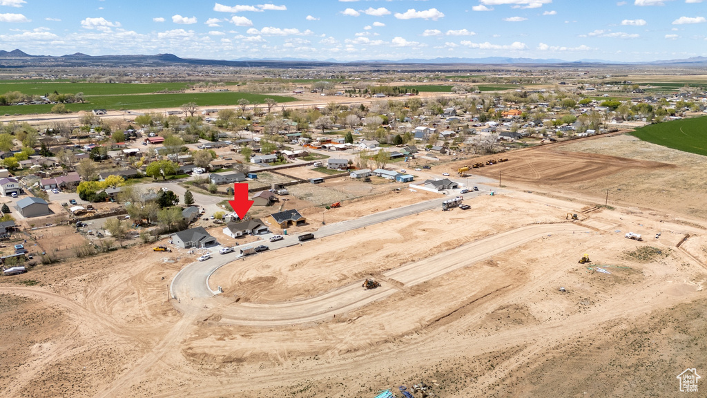 Birds eye view of property with a mountain view