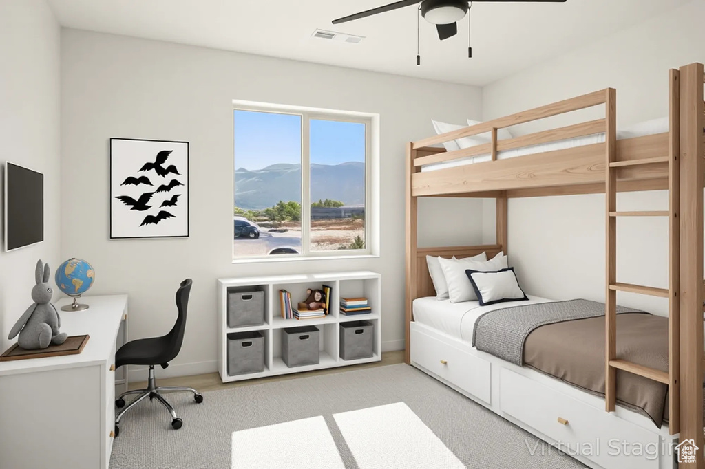 Bedroom featuring a mountain view, carpet, baseboards, and a ceiling fan