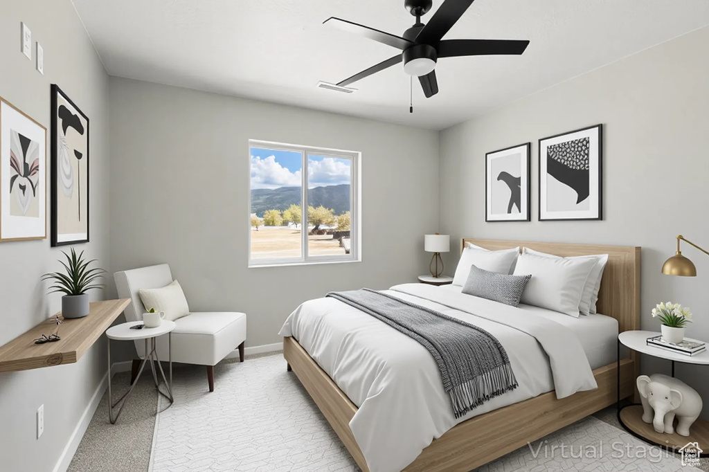 Carpeted bedroom featuring baseboards, a ceiling fan, and visible vents
