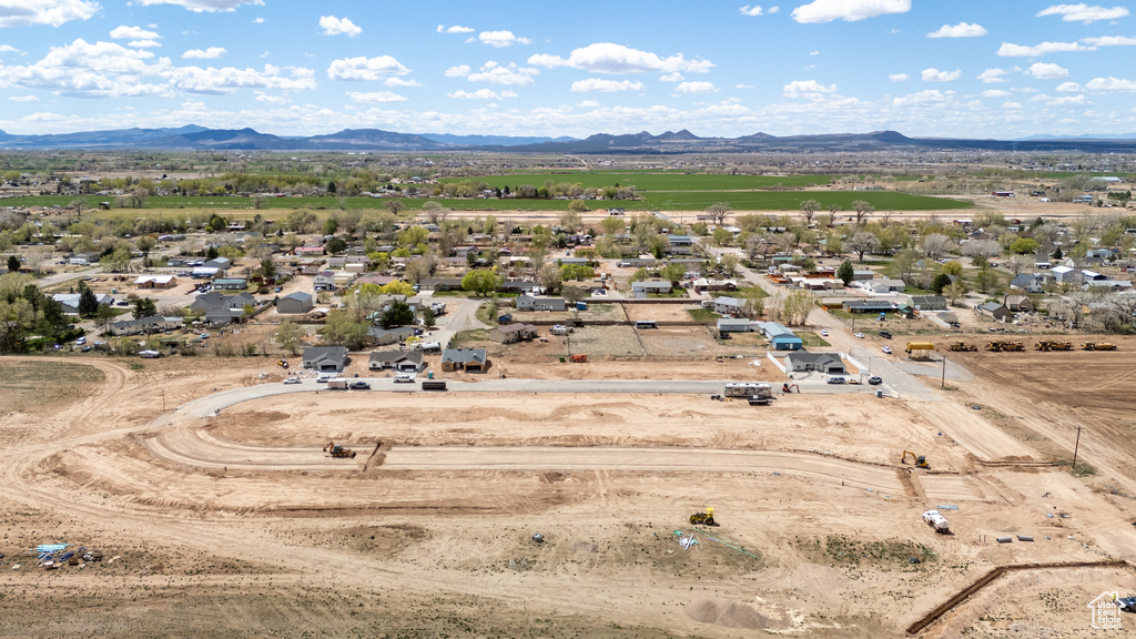 Birds eye view of property with a mountain view