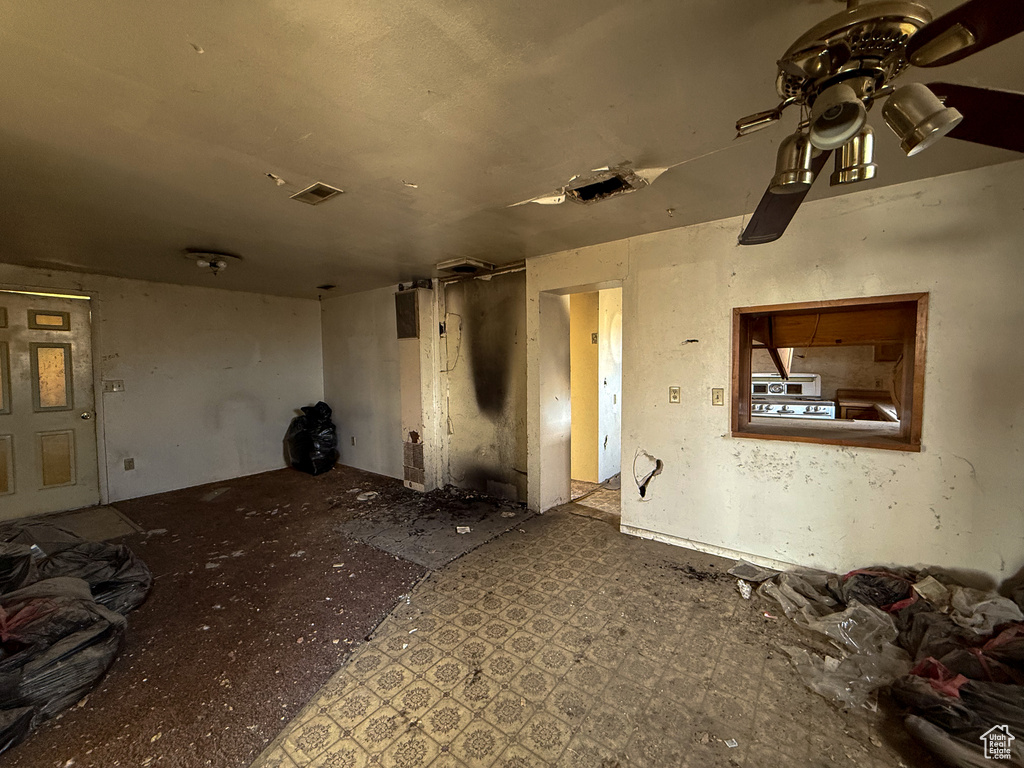 Spare room featuring ceiling fan and visible vents