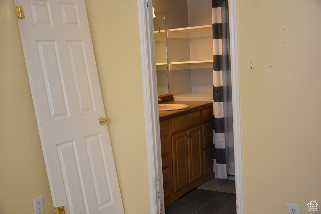 Bathroom featuring vanity and tile patterned floors