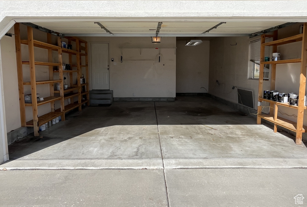 Garage featuring a garage door opener